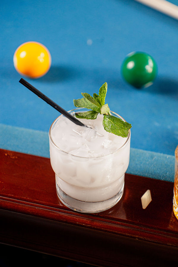 White craft cocktail on the pool table